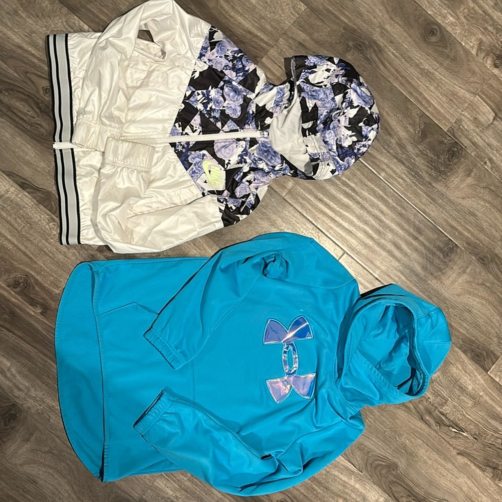 Girls size Large, gently worn, Under Armour hoody and Nike zip up hoody.